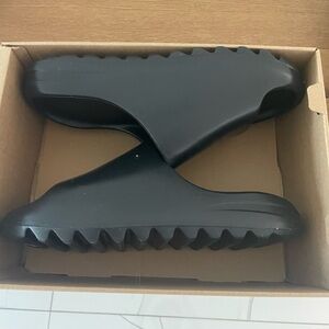 Black Yeezy slides brand new has box and everything that you need